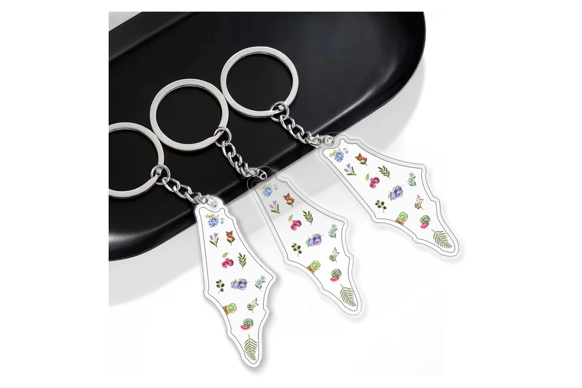 Clear acrylic outline keychains with small printed floral details.
