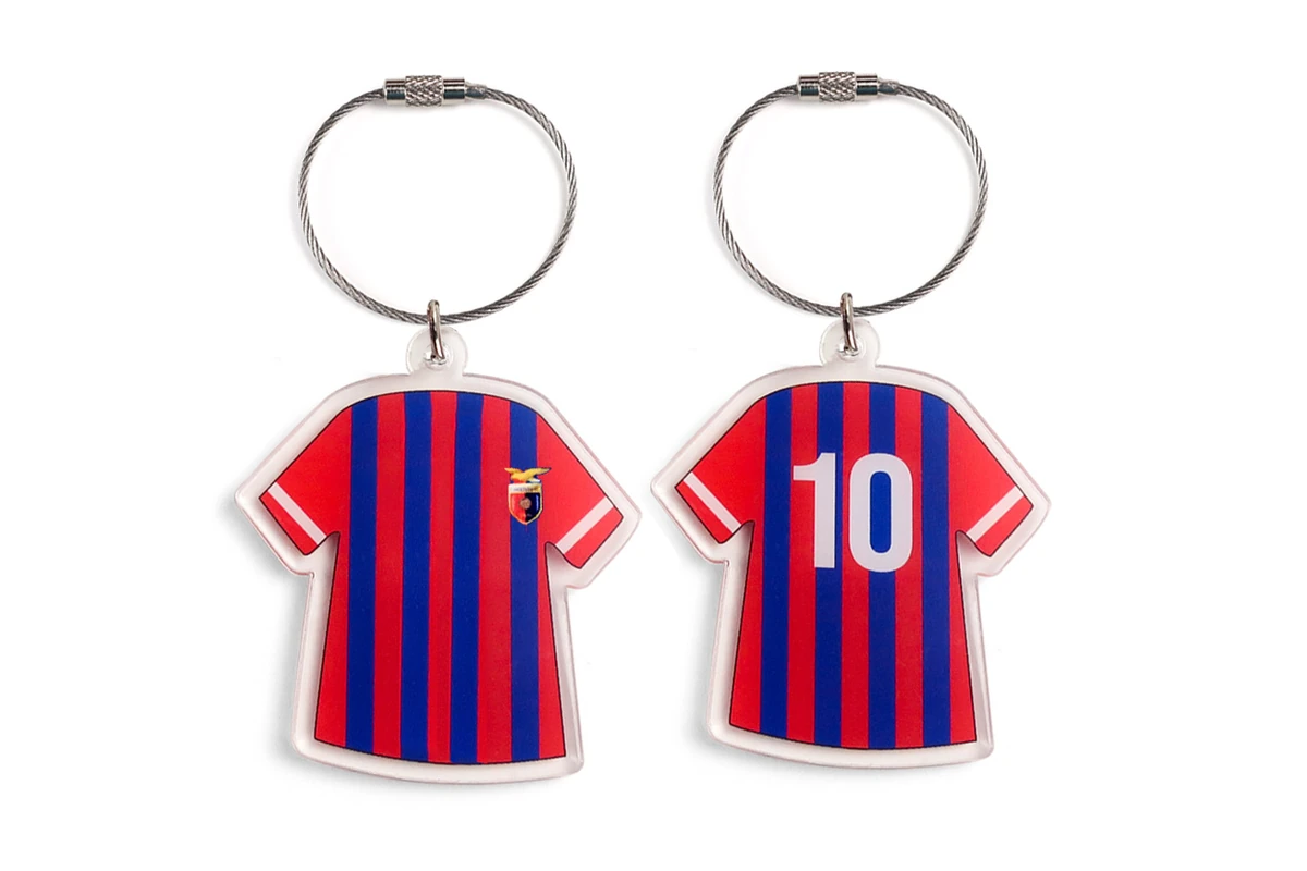 Front and back soccer jersey designs on clear acrylic keychains.