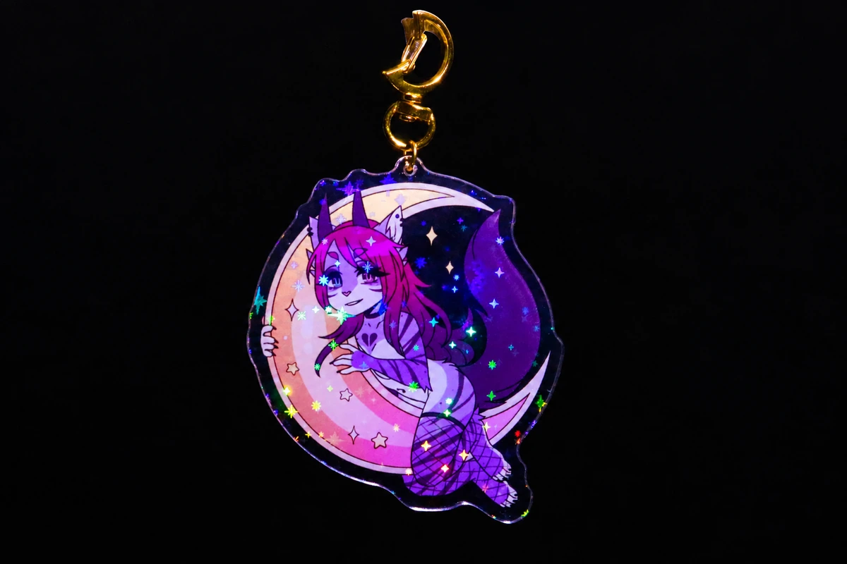 Purple holographic acrylic character charm with a crescent outline.