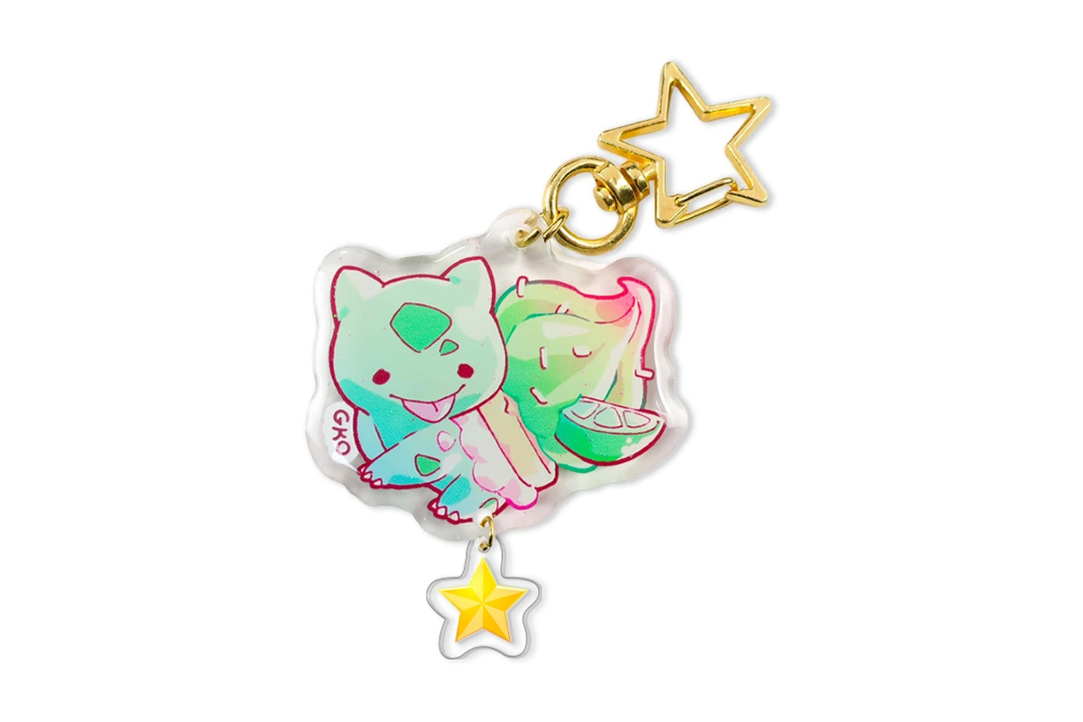 Clear printed acrylic charm with a gold-colored star clasp and small star pendant.