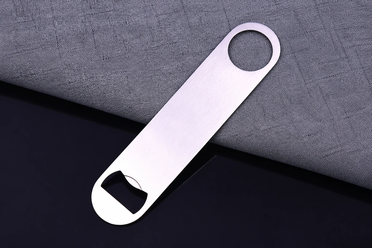 A plain silver-colored bar bottle opener with a circular hanging hole.