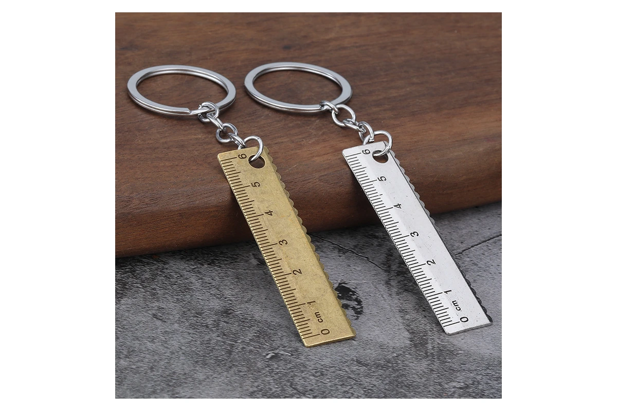 Two miniature ruler keychains with marked measuring edges