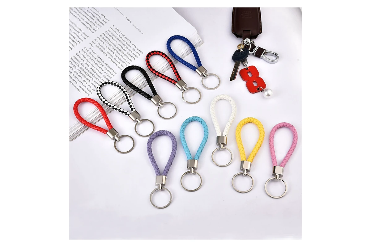 Braided leather key loops in multiple colors with metal end fittings and split rings.
