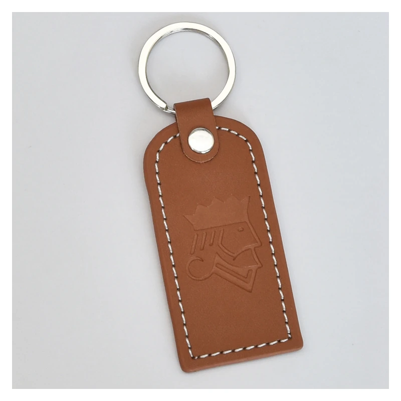 Brown leather key tag with a pressed logo, white stitching and silver-tone ring.