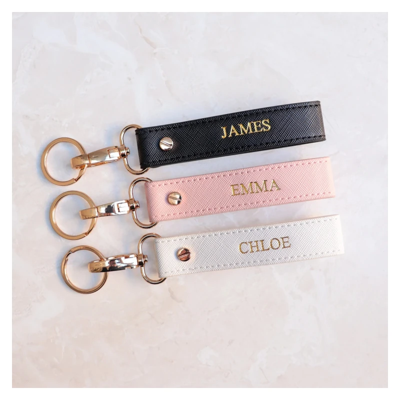 Black, pink and cream leather straps with metallic gold names.