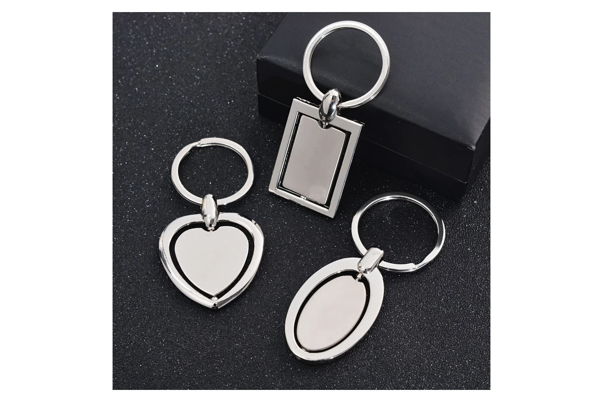 Silver-tone keychains with rectangular, heart-shaped and oval faces.