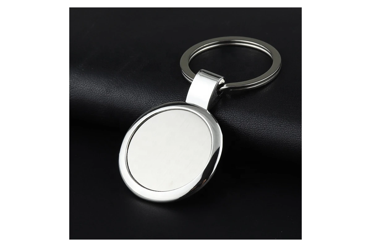 Plain round metal keychain with a silver-tone face and rim.