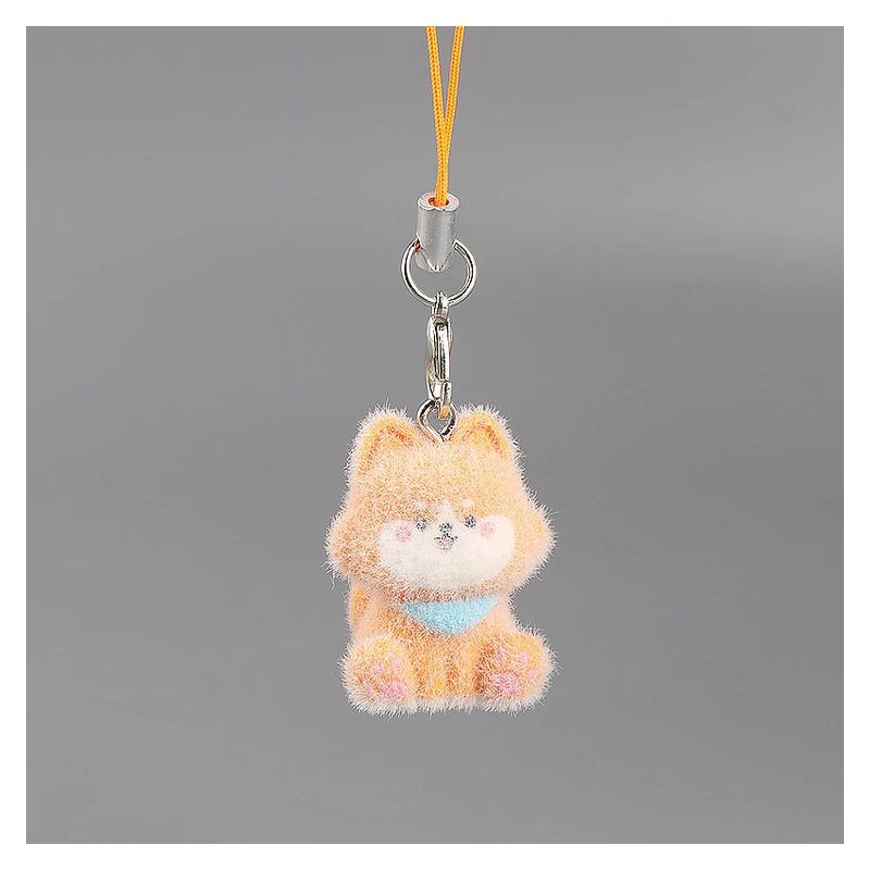 Orange miniature plush cat with a clasp and cord