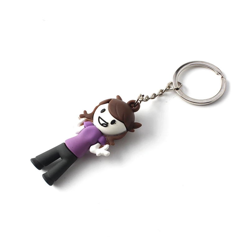 Three-dimensional character keychain with a purple shirt and metal ring.