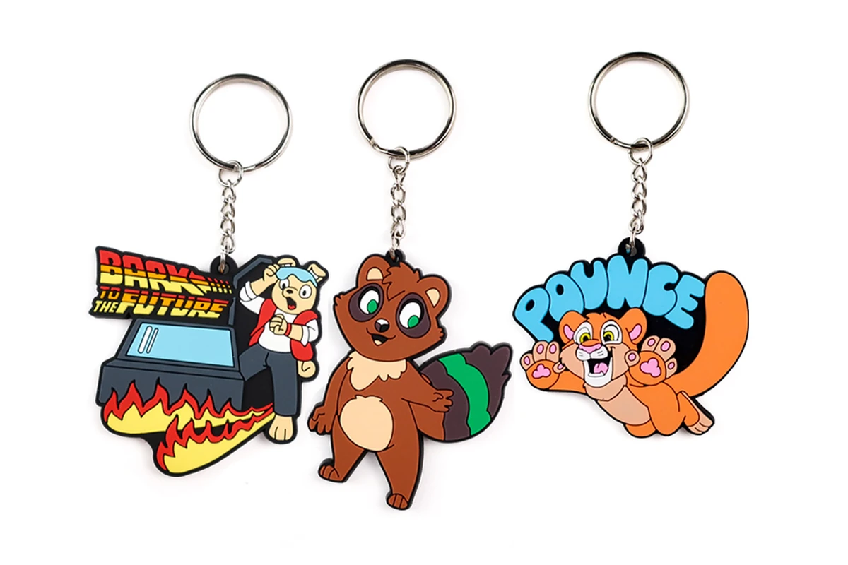 Colorful molded character keychains attached to metal rings and chains.