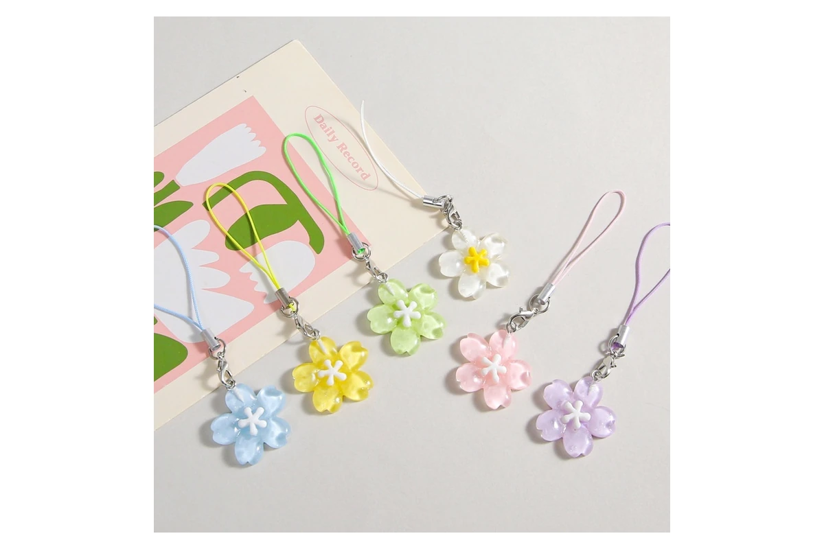 Translucent flower-shaped resin charms in several pastel colors.