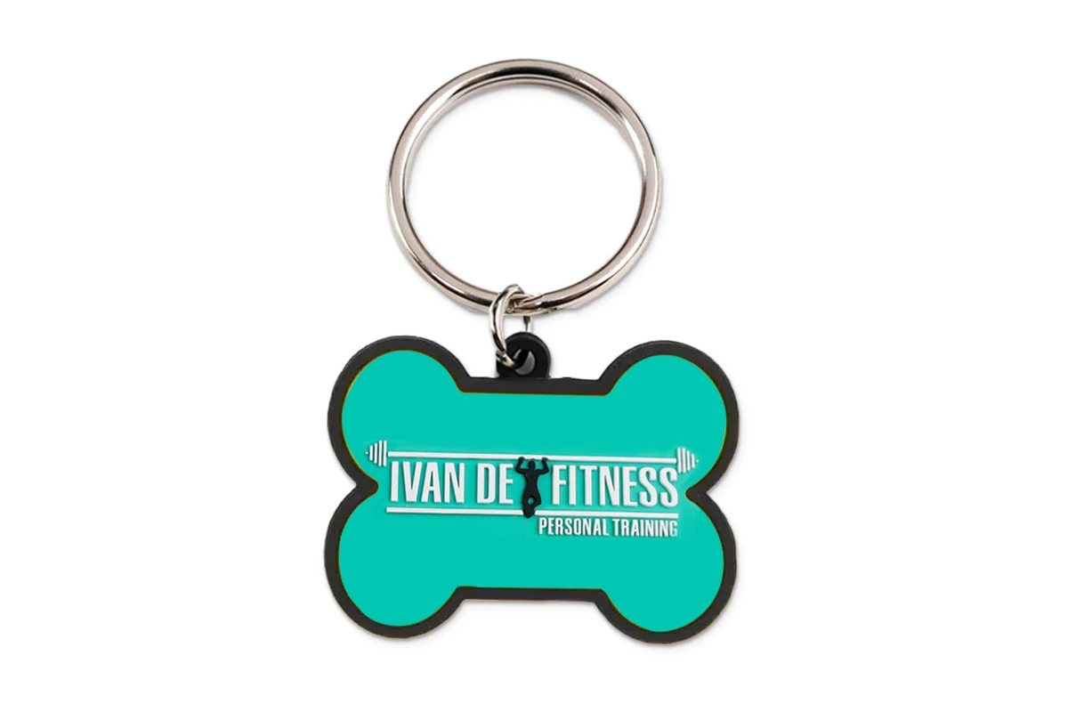 Turquoise bone-shaped silicone keychain with white logo lettering.