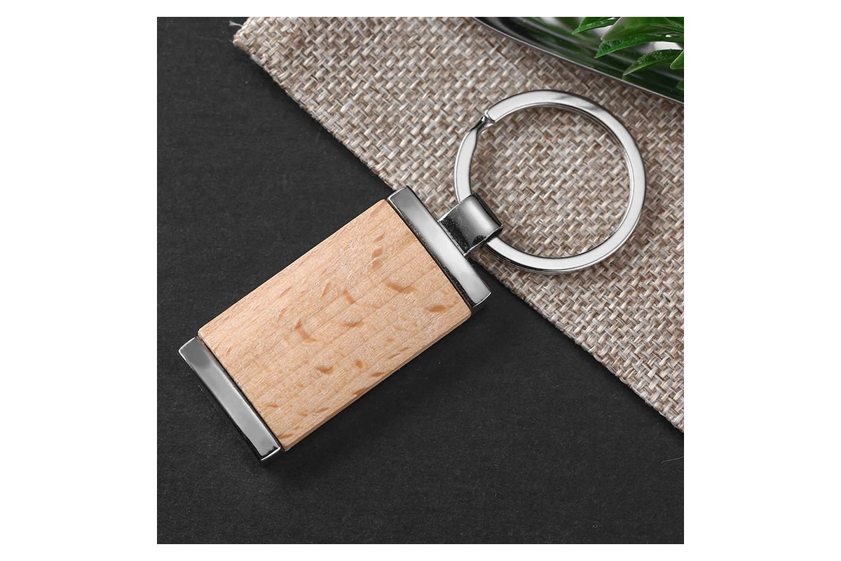 Rectangular keychain combining a wooden center with silver-tone metal ends and ring.