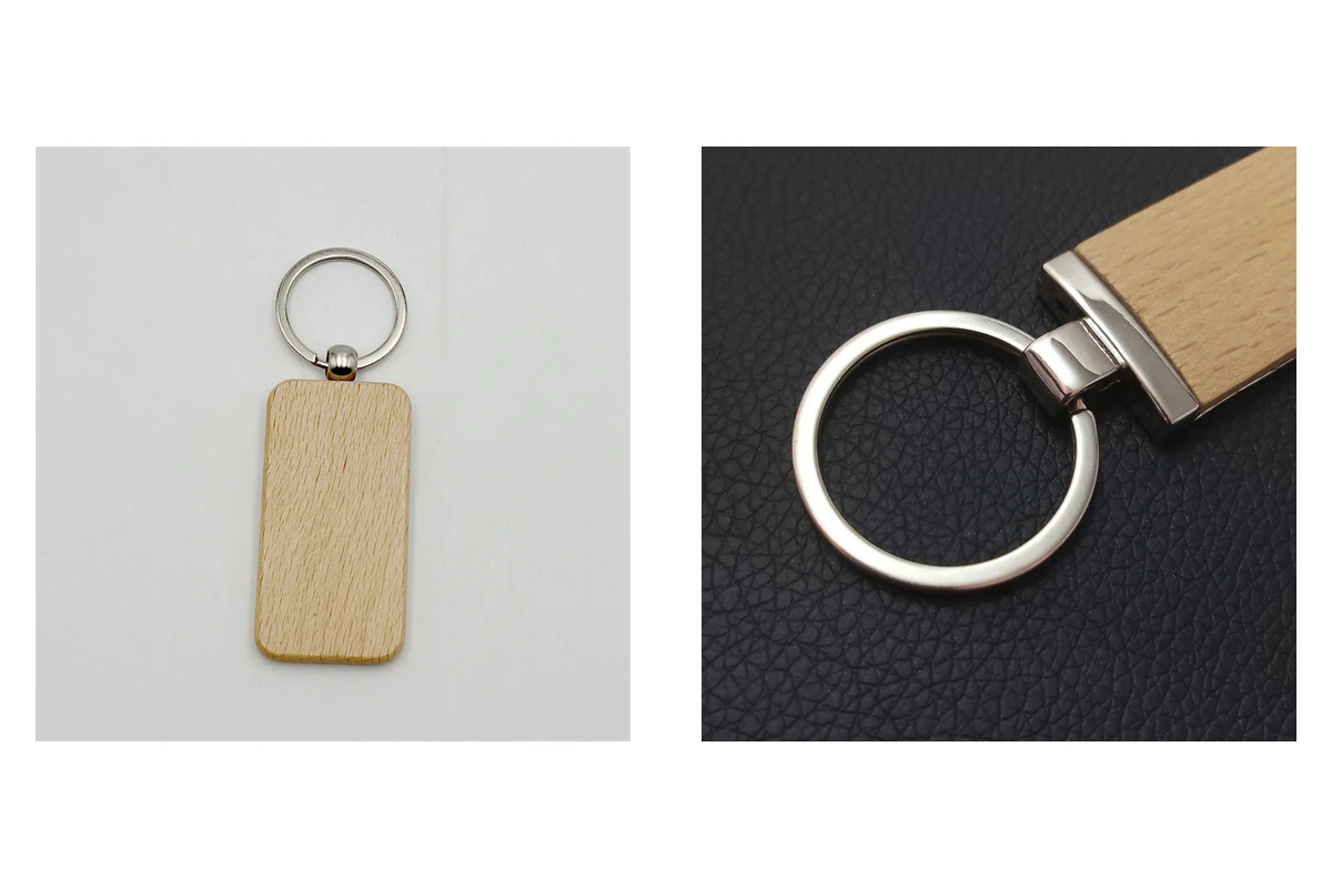 Metal ring attachments on two rectangular wooden keychains.