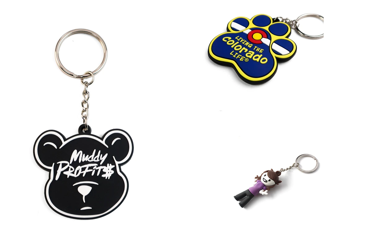 Bear-logo and paw-shaped tags beside a three-dimensional character keychain.
