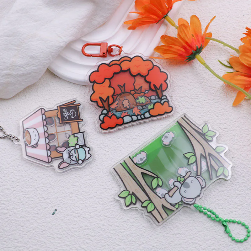Orange woodland charm displayed with illustrated shopfront and green awning charms.