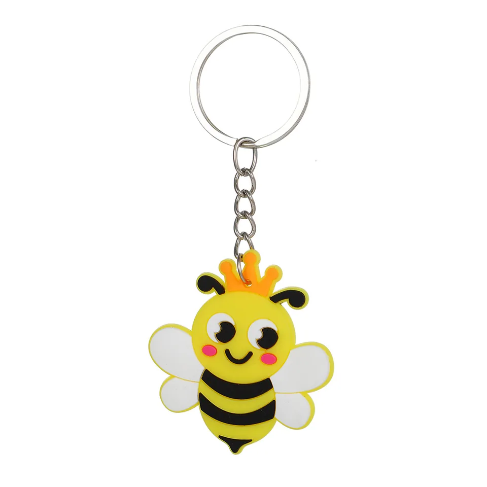 Yellow bee keychain with black stripes, white wings, an orange crown, and a silver-tone ring.