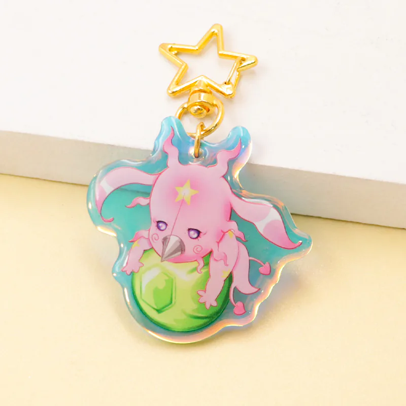 Pink dragon keychain holding a green orb, with a gold-tone star clasp.
