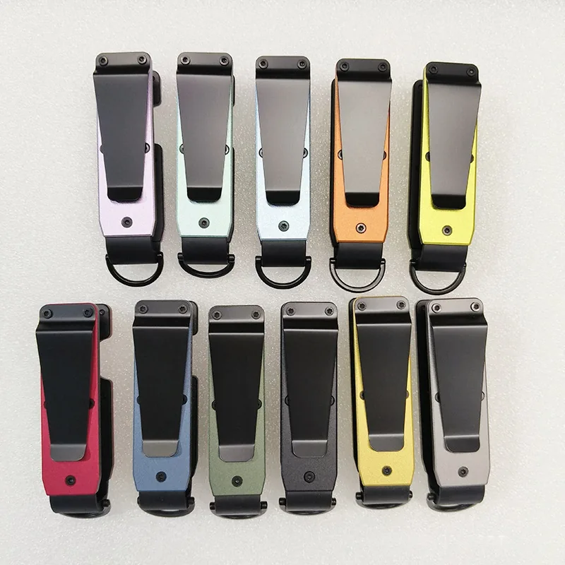 Backs of folding key organizers showing long pocket clips and attachment loops.