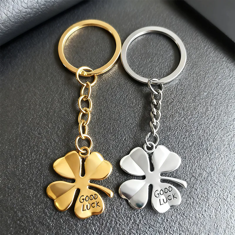 Gold- and silver-tone four-leaf clover keychains with GOOD LUCK lettering.