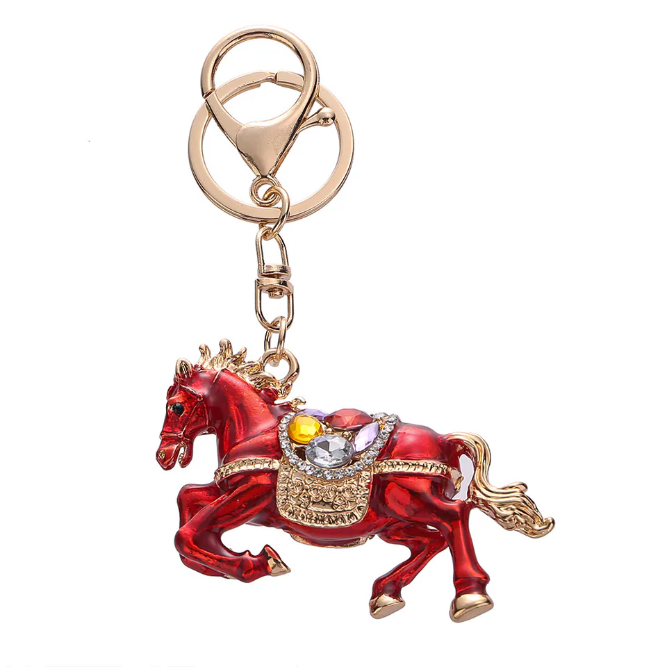 Red horse keychain with gold-tone trim, colorful decorative stones, and a swivel clasp.