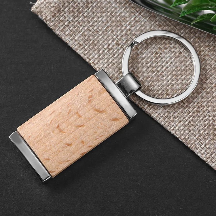 Rectangular wooden keychain with silver-tone end caps and a split ring.