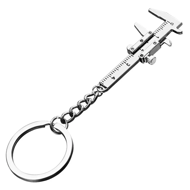 Angled view of a miniature caliper keychain with its sliding jaws open.