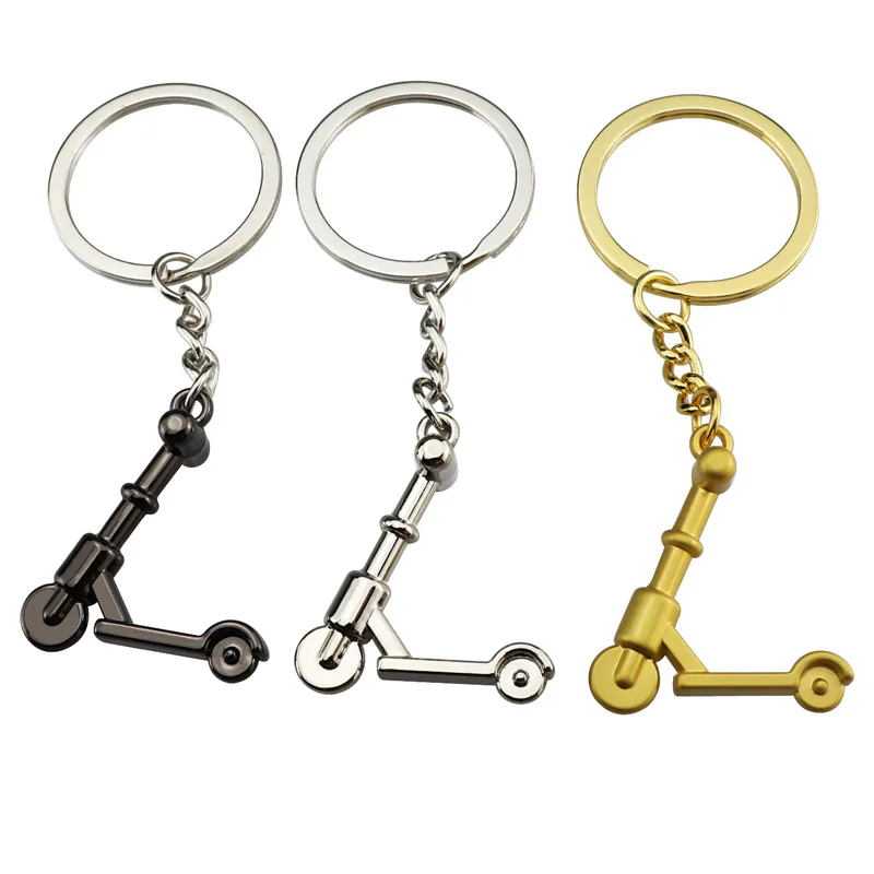 Mini scooter keychains in black, silver, and gold tones.