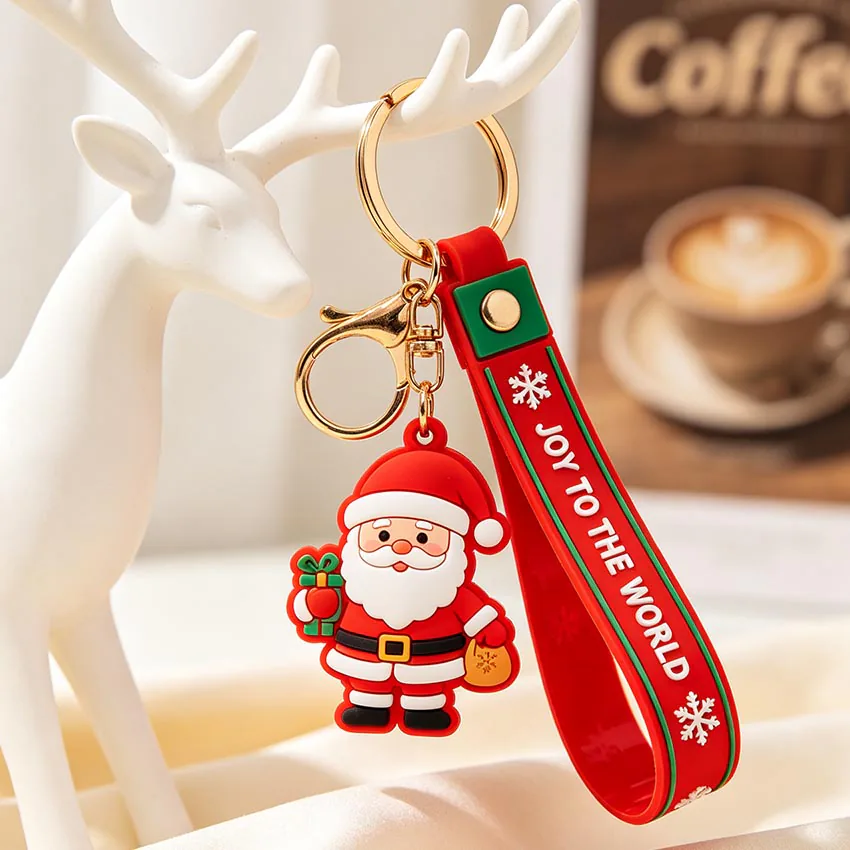 Santa keychain with a red wrist strap and gold-tone clasp and ring.