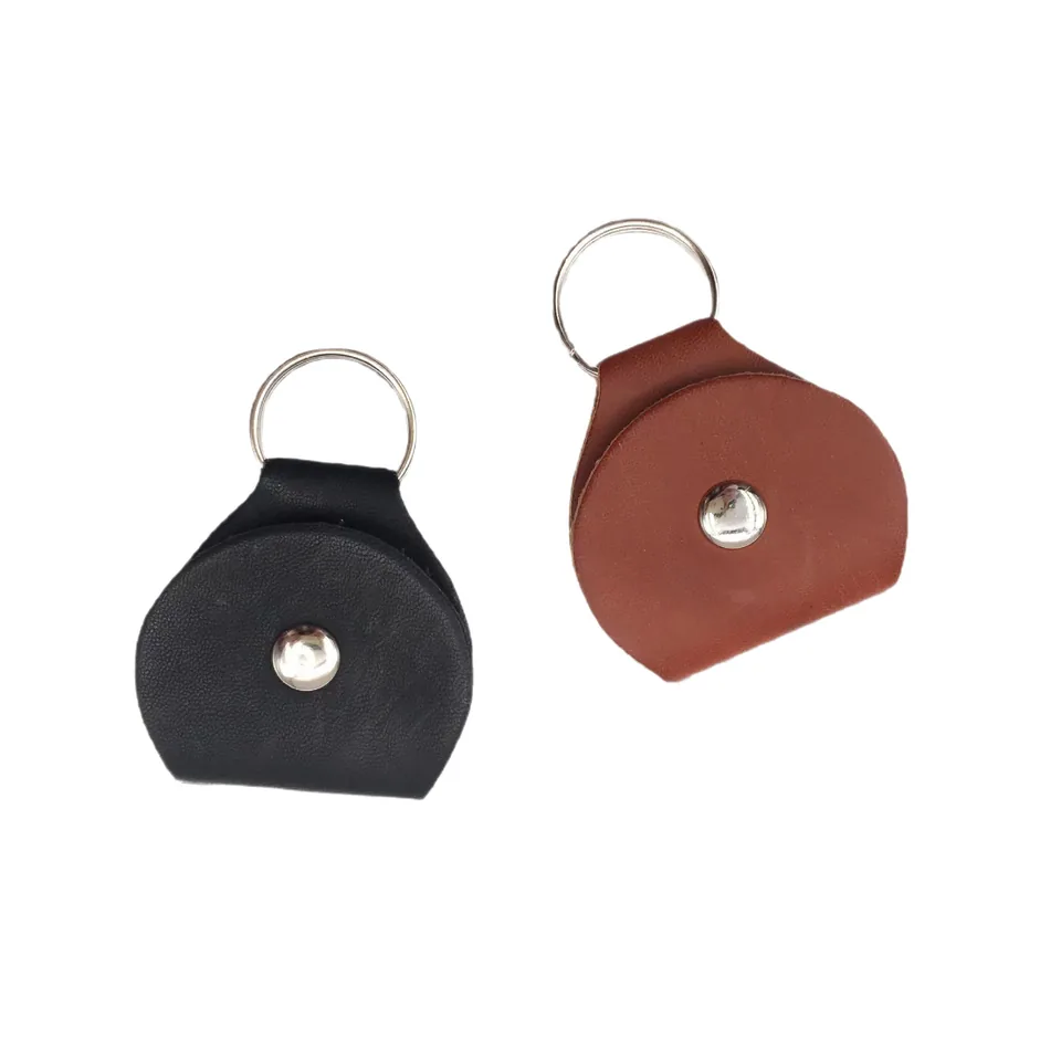 Black and brown mini pouch keychains with rounded flaps and silver-tone snaps.
