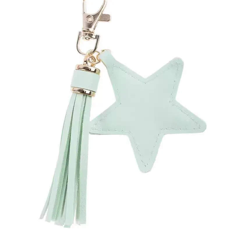 Mint green star charm with a matching tassel and gold-tone clasp.