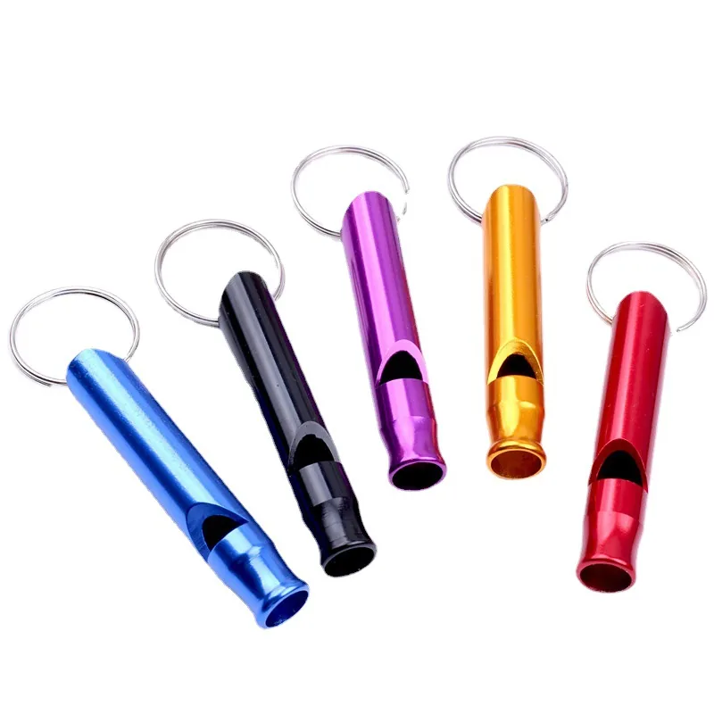 Tube whistle keychains in blue, black, purple, gold, and red with silver-tone rings.