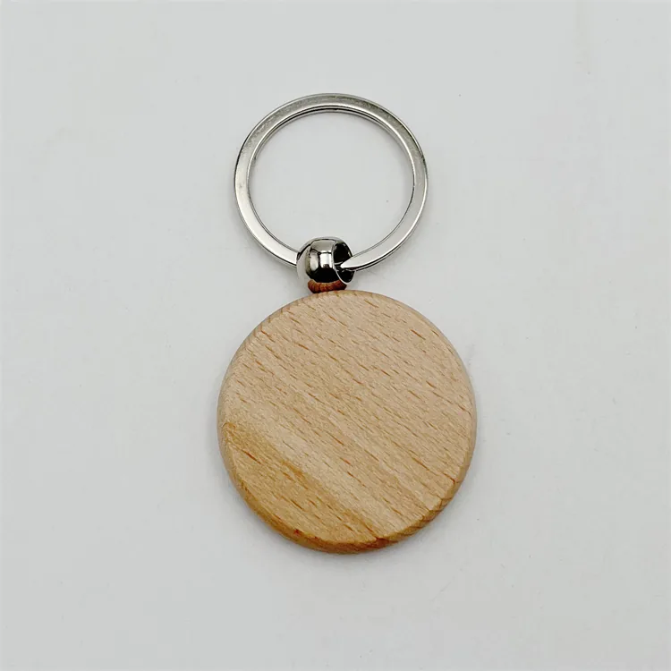 Round wooden keychain with visible grain and a silver-tone split ring.