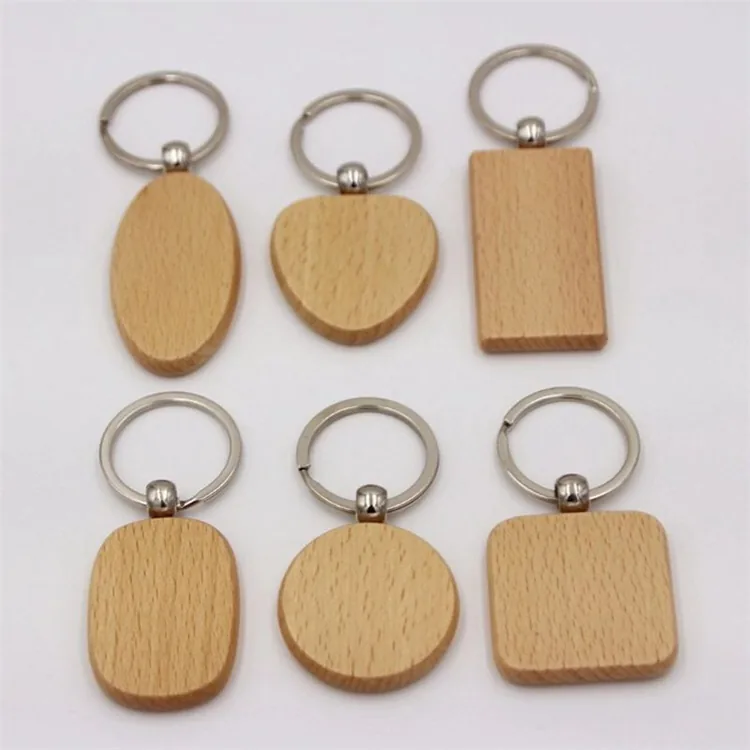 Six wooden keychains in round, oval, heart, rectangular, and square shapes.