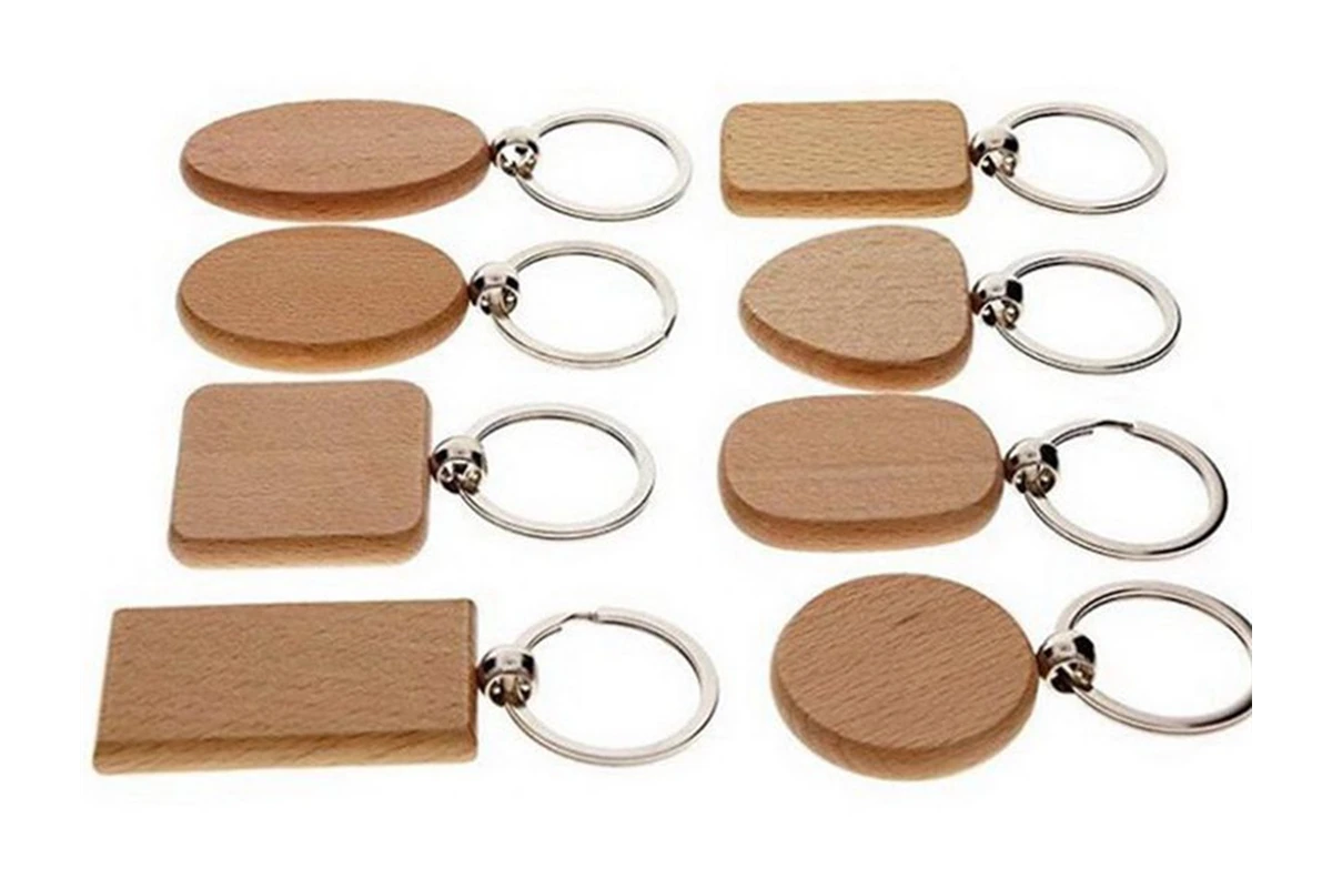 Blank wooden key fobs in round, oval, square, rectangular, and tapered shapes.